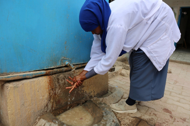 Photo: Midwife nurse washing her hands at the Mother and Child (MCH) Center in Hargeisa, Somalia, 2019. 